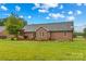 Brick home exterior showcasing a spacious backyard with a deck and pergola at 4336 Hunter Rhyne Rd # 9, Lincolnton, NC 28092