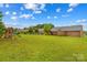 Beautiful, enormous backyard with manicured lawn, play set, and view of a brick home with a deck at 4336 Hunter Rhyne Rd # 9, Lincolnton, NC 28092