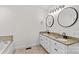 Bright bathroom featuring double sinks with granite countertops, tile flooring, and a soaking tub at 4336 Hunter Rhyne Rd # 9, Lincolnton, NC 28092