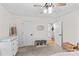 Bright bedroom boasts a changing table, a dark wood chair, and a large window at 4336 Hunter Rhyne Rd # 9, Lincolnton, NC 28092