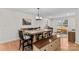 Bright dining room with a large table, modern light fixture, and hardwood flooring at 4336 Hunter Rhyne Rd # 9, Lincolnton, NC 28092