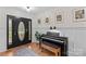 Elegant entryway with a black front door with glass details, a piano, and wood floors at 4336 Hunter Rhyne Rd # 9, Lincolnton, NC 28092