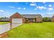 Charming single-story brick home with a well-manicured lawn and a two-car garage at 4336 Hunter Rhyne Rd # 9, Lincolnton, NC 28092
