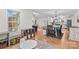Open floor plan featuring a living room with hardwood floors, and a modern kitchen with white cabinets at 4336 Hunter Rhyne Rd # 9, Lincolnton, NC 28092