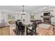 Spacious open-concept living area featuring a dining area and a stone fireplace at 4336 Hunter Rhyne Rd # 9, Lincolnton, NC 28092