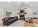 Cozy living room with a stone fireplace, mounted TV, plush sofa, and hardwood floors for relaxing evenings at 4336 Hunter Rhyne Rd # 9, Lincolnton, NC 28092
