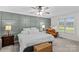 Calming primary bedroom with a gray accent wall, ceiling fan, and large windows at 4336 Hunter Rhyne Rd # 9, Lincolnton, NC 28092