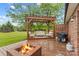 Cozy outdoor deck with a pergola, fire pit, and comfortable seating for relaxation at 4336 Hunter Rhyne Rd # 9, Lincolnton, NC 28092