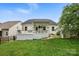 Back exterior of a home featuring a deck, porch, and green grass at 4842 Durneigh Dr, Kannapolis, NC 28081