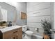 Modern bathroom featuring a wood vanity, stylish mirror, and decorative accents at 4842 Durneigh Dr, Kannapolis, NC 28081
