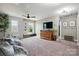 Open bonus room featuring carpeted flooring, modern ceiling fan, and natural light at 4842 Durneigh Dr, Kannapolis, NC 28081