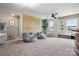 Spacious bonus room featuring carpeted flooring, modern ceiling fan, and natural light at 4842 Durneigh Dr, Kannapolis, NC 28081