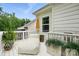White deck featuring an outdoor lounge chair and potted plants at 4842 Durneigh Dr, Kannapolis, NC 28081