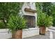Outdoor fireplace featuring a brick surround and wooden mantle at 4842 Durneigh Dr, Kannapolis, NC 28081