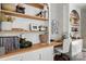 Bright home office with custom built-in desk, shelving, and white cabinetry offering ample storage space at 4842 Durneigh Dr, Kannapolis, NC 28081