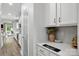 Well-lit kitchen featuring white cabinets and stylish countertop decor at 4842 Durneigh Dr, Kannapolis, NC 28081