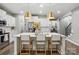 Bright kitchen featuring a large island with seating, modern appliances, and stylish pendant lights at 4842 Durneigh Dr, Kannapolis, NC 28081