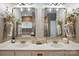 Bright bathroom featuring double sinks, framed mirrors and stylish sconces at 4842 Durneigh Dr, Kannapolis, NC 28081