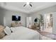 Tranquil main bedroom with a neutral color palette, tray ceiling and a view into the main bathroom at 4842 Durneigh Dr, Kannapolis, NC 28081