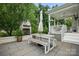 A stone patio with a built-in fireplace and plenty of space to relax at 4842 Durneigh Dr, Kannapolis, NC 28081