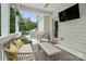 Relaxing back porch with comfortable wicker furniture, perfect for outdoor living and entertaining at 4842 Durneigh Dr, Kannapolis, NC 28081