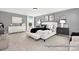 Spacious main bedroom with art, lamps, bench, and a view to the outside at 499 Switch St # 128, York, SC 29745