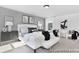 This main bedroom has a large bed, lots of pillows, decorations, and bench at 499 Switch St # 128, York, SC 29745