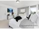 Main bedroom with a large bed, side table, art work, and gray walls at 499 Switch St # 128, York, SC 29745