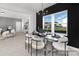 Bright dining room with modern chandelier, seating for six, and a view of the outdoors at 499 Switch St # 128, York, SC 29745