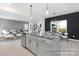 Bright, open kitchen with island and view into living and dining area, perfect for entertaining at 499 Switch St # 128, York, SC 29745