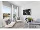 Bright home office with lots of light, two white chairs, gray desk and modern decor at 499 Switch St # 128, York, SC 29745