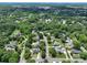 Wide aerial view showing the area's plentiful trees and neighborhood layout at 503 New Castle Ne Ct, Concord, NC 28025