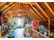 Finished attic space with exposed wood beams, storage and decorations at 503 New Castle Ne Ct, Concord, NC 28025