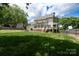 Well-maintained backyard showcasing the home's rear facade at 503 New Castle Ne Ct, Concord, NC 28025