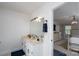 Bright bathroom features double sinks, a large mirror with vanity lighting, and access to the main bedroom at 503 New Castle Ne Ct, Concord, NC 28025