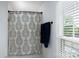 Bathroom features a patterned shower curtain and a window with natural light at 503 New Castle Ne Ct, Concord, NC 28025