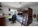 Bedroom features a wood bunk bed, desk, and a ceiling fan at 503 New Castle Ne Ct, Concord, NC 28025