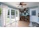 Sun-filled dining area with large windows, hardwood floors, and stylish decor and built-in shelves at 503 New Castle Ne Ct, Concord, NC 28025