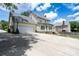 Back exterior of house, featuring a basketball hoop, garage, lots of parking, and a backyard at 503 New Castle Ne Ct, Concord, NC 28025