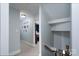 Bright hallway leading to bedroom featuring neutral colors and staircase at 503 New Castle Ne Ct, Concord, NC 28025