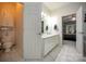 This bathroom has dual sinks, tile floors, and private toilet and bedroom entrances at 6009 Swanston Dr, Charlotte, NC 28269