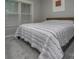 Comfortable bedroom features a plush bed with decorative patterned quilt and sunlit window at 6009 Swanston Dr, Charlotte, NC 28269