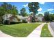 Beautiful suburban home with manicured lawn and mature trees, showcasing curb appeal at 6009 Swanston Dr, Charlotte, NC 28269