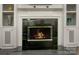 Cozy fireplace with marble surround and built-in shelving in the living room at 6009 Swanston Dr, Charlotte, NC 28269