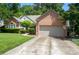Well-maintained brick home with a spacious two-car garage and a basketball hoop at 6009 Swanston Dr, Charlotte, NC 28269