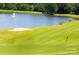 Scenic golf course view with a water feature, offering a beautiful backdrop for golfers at 6009 Swanston Dr, Charlotte, NC 28269