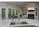 Spacious kitchen area overlooking the living room with fireplace and backyard views at 6009 Swanston Dr, Charlotte, NC 28269