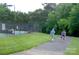 Picturesque walking trail alongside tennis courts, ideal for a leisurely stroll or exercise at 6009 Swanston Dr, Charlotte, NC 28269