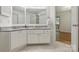 Bright bathroom featuring dual sinks with granite countertops, tile floors, and neutral paint at 6016 Gray Gate Ln # C, Charlotte, NC 28210