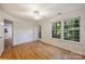 Bright bedroom with hardwood floors, ceiling fan, natural light and access to the exterior at 6016 Gray Gate Ln # C, Charlotte, NC 28210